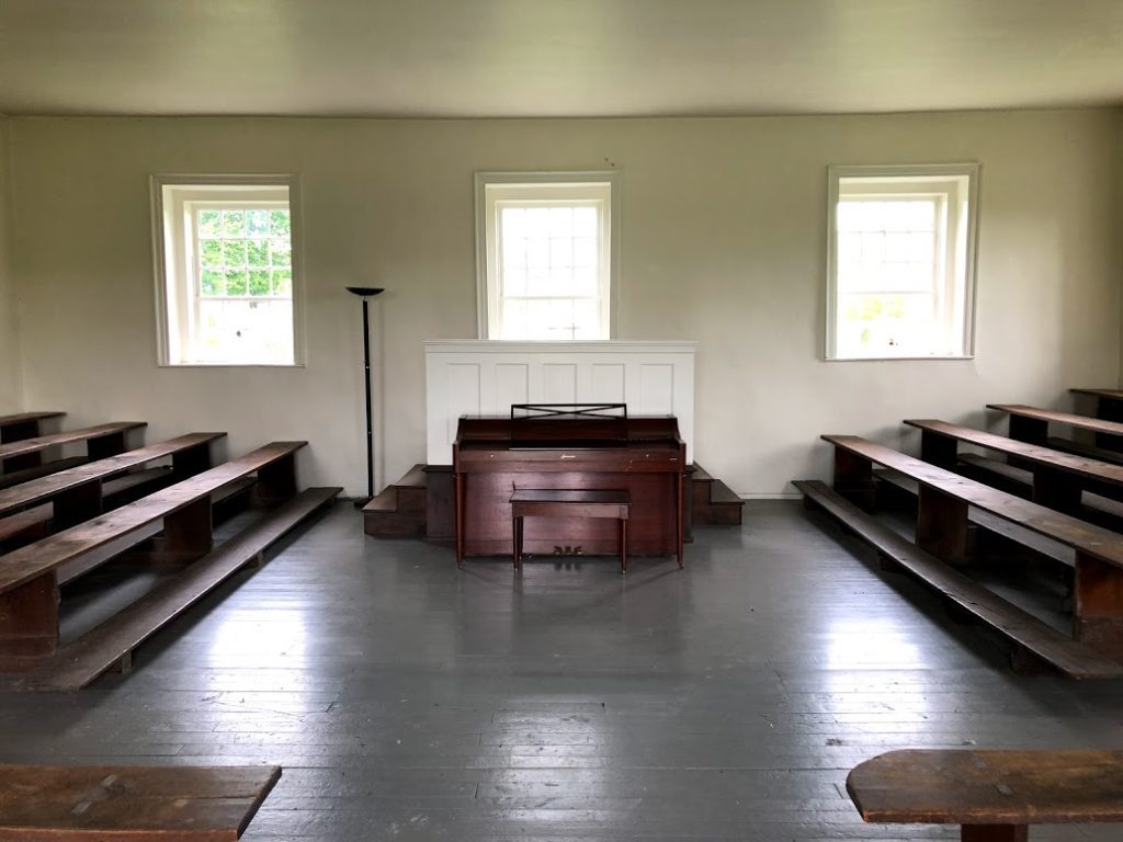 Interior of the 1825 Mennonite Meetinghouse, original bench seating